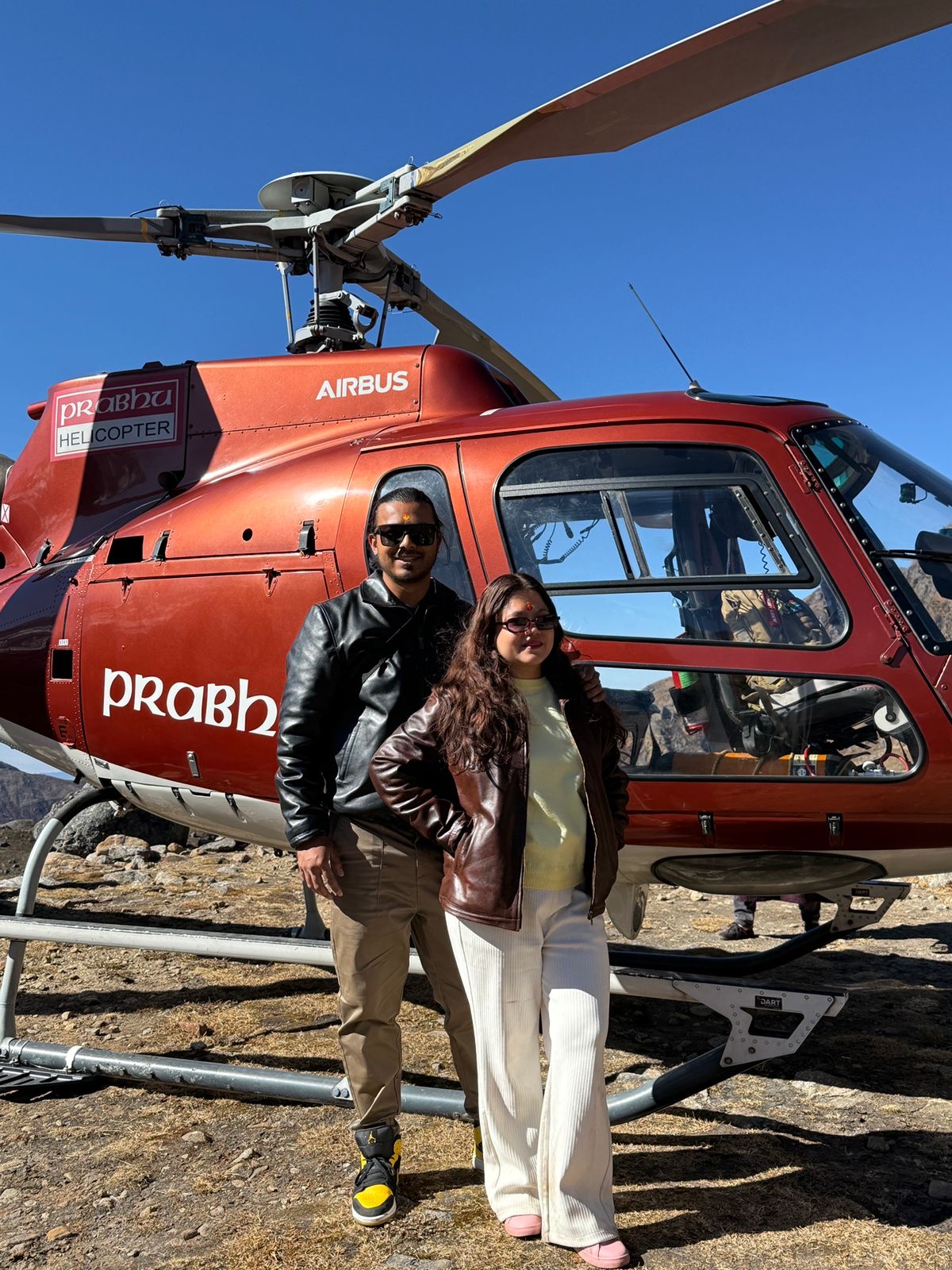 Clients by a helicopter